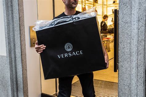 michael kors buys versace for 2.1 billion|does michael kors own versace.